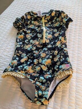 Ruffle Butts Black Floral One-Piece Swimsuit with Yellow and Aqua Accents